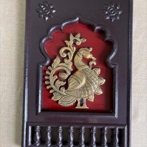 Brass Peacock motif(right looking) set in a traditional Indian wooden frame 12"